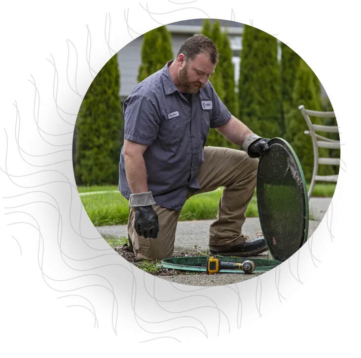 Technician inspecting septic system